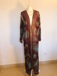 "A Beautiful Kimono Jacket,Robe . Long,light,sequinned and floaty ; A Perfect Cover Up for Holidays , Weddings and Parties. This has been Handmade from a Vintage Indian Sari.... so is completely Unique and Sustainable. A Wonderfully Chic,Aubergine Silk Chiffon,Embellished all over with Lovely Duck Egg embroidery, and 1000's of Glittering Gold and Iridescent Sequins,. One Size S M L UK size 8 to 16 US 6 to 12 European 36 to 44, The length is 135 cm / 53 \". The sleeves are 55 cm / 21.5 \". This B Embellished Long Sleeve Silk Outerwear, Festive Fitted Beaded Outerwear, Beaded Fall Festive Outerwear, Festive Beaded Fall Outerwear, Bohemian Style Embellished Outerwear For Party, Bohemian Embellished Party Outerwear, Bollywood Style Long Sleeve Silk Kaftan, Festive Long Sleeve Sequin Outerwear, Long Kaftan For Party And Festivals