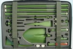 an assortment of green tools in a black case