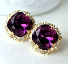 Eye-catching, classy, amethyst crystal earrings will add a little sparkle to any outfit! Swarovski's precision-cut crystals and unmatched, gorgeous colors are always show stoppers!  * Earring Size- 3/4"(18mm) * Gold-Plated or Sterling Silver-Plated Earrings These earrings come in a jewelry bag and box with ribbon.  * If you would like a different color or want to order more than what's available, please contact me, I'm happy to help! Elegant Purple Crystal Earrings For Evening, Purple Crystal Earrings For Pierced Ears, Elegant Amethyst Crystal Earrings For Wedding, Amethyst Purple Earrings For Wedding, Purple Amethyst Earrings For Wedding, Elegant Round Amethyst Crystal Earrings, Halo Stud Earrings, Box With Ribbon, Stud Earrings Gold