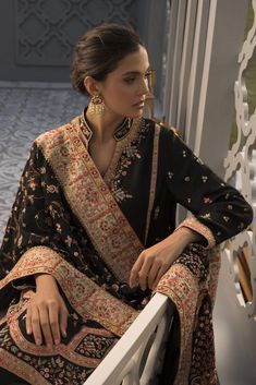 This handcrafted aari embroidered shirt features foliage and animals that are reminiscent of the mughal era. The pops of colour of threadwork and embellishment on the depth of black has stunning finesse. Paired with rawsilk trousers and an heirloom self jamawar aari shawl with worked borders, this piece is one that you Loose Shirt Dress, Loose Shirt, Floral Tapestry, Organza Dupatta, Pakistani Designers, Indian Clothes, Fabric Stores Online, Best Wear, Fashion Shoot