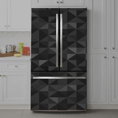 a black and silver refrigerator in a white kitchen