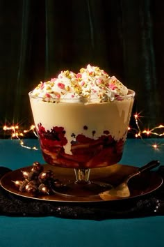 a dessert dish with whipped cream, chocolate and sprinkles