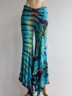 "Handmade Materials: Cotton, Lycra Description These tie dye splatter bell bottoms are made for movement! Perfect for yoga and flow activities. Handmade and hand-dyed, available from a variety of 4 colour ways to choose from 🌸 The fitting around the thigh is flattering & shaping until the material billows out at the knee into a wide flare. Featuring drawstrings on either side of the thigh that can be cinched for shape and length adjustment! The material consists of a quality Rayon 95% spandex 5 Flow Activities, Purple Bell Bottoms, Black Bell Bottoms, Hippy Festival, Colour Ways, Cute Leggings, Womens Trousers, Flared Trousers, Festival Clothing