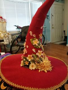 a large red hat with flowers on it