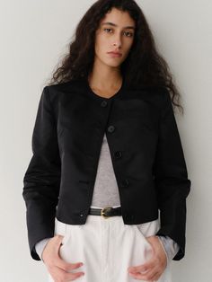 Minimal mood jacket that made of 100% re-nylon material. Featuring the simple rounded neckline, curvy seam lines at side seam, and minimal silhouette. The buttons that have same color as the jacket are also accentuated. Style with simple t-shirts and trousers to create minimal and basic outfit. - Clean rounded neckline and long sleeves- Five-button closure that has same color with the jacket- Curvy seam lines at side seam- Standard silhouette and short length Sleek Spring Outerwear With Buttons, Sleek Spring Outerwear With Button Closure, Sleek Fitted Outerwear With Buttons, Simple Tshirt, Rounded Neckline, Basic Outfits, Casual Coat, Casual Jacket, Jackets & Coats