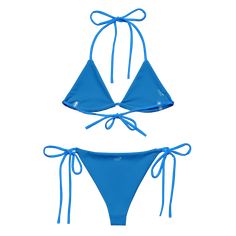 Stay comfortable and beach ready all summer in this FYC String Bikini set. It’s made from soft recycled polyester with double-layering and UPF 50+. Style the straps how you like, and get ready to swim! • Soft and stretchy material with UPF 50+ • Sizes up to 4XL • Bikini top comes with removable padding for comfort • Multiple ways to tie and style the bikini set Disclaimer: To make your All-Over Print Recycled String Bikini last longer, thoroughly rinse it off after each use and get rid of any ch Seamless Nylon Swimwear For Water Sports, Adjustable Seamless Swimwear For Beach Season, Summer Swimwear For Poolside With 4-way Stretch, Summer Swimwear With 4-way Stretch For Poolside, Summer Poolside Swimwear With 4-way Stretch, Triangle Top Swimwear With Upf 50+ For Beach Season, T-back Swimwear With Adjustable Straps For Beach, Summer Swimwear With 4-way Stretch And Tie-side Bottom, Summer Swimwear With 4-way Stretch For Beach Season