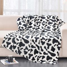 PRICES MAY VARY. SOFTER AND WARMER: BNuitland Cow Blanket is made of 300 GSM super soft high quality Flannel, Our double-sided cow blanket is made of 100% skin friendly which keep you warm in the upcoming cold days. You can use the Cow Print Throw for Wearable Blanket, Sofa Throw, Bed Blanket, Travel Blanket, Pet Blanket, Picnic Blanket, bed decoration and so on. PERFECT GIFT: Our Cow Print blanket is a real fantastic gift for kids, Teenagers, Adults, Girls, Women or anyone you cherished. Perfec Cowhide Blanket, Black And White Bed, Cow Print Blanket, Mom Bedroom, Sofa Cozy, Pretty Blankets, Small Bedroom Ideas, White Bed, Small Blankets