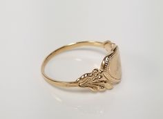 "Thanks for shopping our vintage estate store. We tend to sell well below wholesale and truly hope you enjoy all of our items. Many of the items are one of a kind, so please enjoy scrolling through the pictures and hopefully something will catch your eye. Brown spots are from camera or reflections. Estate 14k yellow gold monogram cursive capital M heart ring. Custom made ring for our shop. Ring size: 3 Setting: 7.5mm 1/4\" to 3/8\" Band width: 1.4mm Weight: 1.09 grams Marked 14k and it's sweet. Vintage Gold Initial Ring Stamped 14k, Gold Engraved Initial Ring Collectible, Gold Engraved Initial Ring, Vintage Yellow Gold Signet Ring With Hallmarks, Vintage Personalized 14k Gold Engraved Ring, Vintage 14k Gold Rings For Gift, Classic Gold Initial Ring Collectible, Vintage Gold Initial Ring For Anniversary, Vintage Engraved 14k Gold Ring With Hallmark