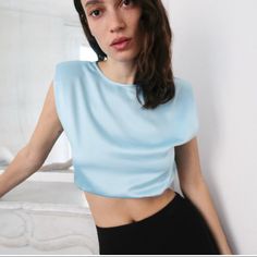 Satin Effect Crop Top With Elastic Hem And Shoulder Pads. Super Cute! Chic Blue Evening Top, Chic Fitted Light Blue Top, Chic Light Blue Fitted Top, Elegant Light Blue Top For Evening, Chic Blue Stretch Blouse, Trendy Blue Sleeveless Blouse, Light Blue Crop Top For Night Out In Spring, Chic Blue Tops For Party, Light Blue Casual Blouse For Party