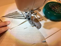 someone is using a sewing machine to sew something