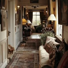 a living room filled with furniture and lamps