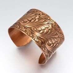 COPPER Bracelet, Copper Jewelry, Solid COPPER Cuff, Copper Cuff Scroll Design, Lacquered Copper Cuff Bracelet, Copper Cuff Bracelet □ Antiqued Copper Cuff - 1 Piece □ Size: 1.5 inches wide - Scroll design SOLID COPPER, not plated Stunning detail on these beautiful embossed cuffs. These are very sturdy but adjustable The tooling dates back to the 1940s and cannot be duplicated in today's market. Unlike my raw cuff collection, these special pieces are hand antiqued, hand polished and have a baked Handmade Bronze Cuff Jewelry, Adjustable Etched Cuff Jewelry, Adjustable Etched Bronze Bracelets, Copper Etched Bracelets As A Gift, Engraved Copper Bracelet Jewelry, Adjustable Etched Bronze Cuff Bracelet, Adjustable Bronze Etched Cuff Bracelet, Adjustable Etched Copper Jewelry, Bronze Cuff Bracelet As Gift