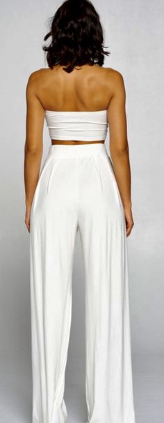 Sexy, 2 piece set with high waist palazzo pants and strapless tube top. (TOP CAN BE TIED AND WORN IN MULTIPLE WAYS) 95% RAYON/ 5% SPANDEX Model is wearing a size SMALL Solid Color Wide Leg Summer Sets, Solid Color Wide Leg Sets For Vacation, Summer Solid Color Wide Leg Sets, White High Waist Crop Top For Spring, White High-waisted Crop Top For Spring, Solid Color High-waisted Pants Set For Summer, Summer Solid Color High-waisted Pants Set, Summer Sets With Solid High-waisted Pants, Solid High-waisted Pants Sets For Summer