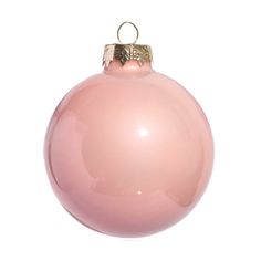 a pink christmas ornament hanging from a string on a white background with clippings