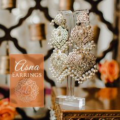 Celebrate your beauty and look phenomenal by wearing our Asna Earrings! Exquisite dangle earrings embellished with CZ stones and beads. Approximate earrings length is 4". Gold-plated on high-quality brass as base metal. In-stock & ready-to-ship. *Please Note: We use faux stones and beads in all of our jewelry.