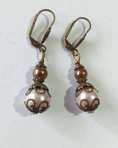 Victorian rose pearl bronze earrings bohemian earrings Boho pearl earrings vintage earrings antique earrings gift earrings wedding earrings Beautiful Victorian style earrings made of crystal rose and brown pearls beads and bronze-tone filigree ornaments . Victorian filigree earrings .  Bronze beautiful Boho earrings. Bohemian earrings . Victorian style bronze-tone rose and brown crystal pearl beads dangle earrings and necklace . Romantic jewelry set pearls earrings . Bridal jewelry set. Wedding Elegant Beaded Copper Jewelry, Elegant Antique Gold Earrings With Lever Back Ear Wires, Elegant Beaded Bronze Jewelry, Elegant Bronze Beaded Jewelry, Vintage Brass Pearl Drop Earrings, Elegant Copper Bead Jewelry, Elegant Brown Metal Beaded Earrings, Elegant Bronze Lever Back Earrings, Elegant Copper Beaded Jewelry