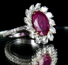 PRODUCT DETAILS PCS 1/CTS 3.85 NATURAL RUBY OVAL  PCS 13 /CTS 2.35 DOUBLE CUT PEAR DIAMOND  PCS 35 /CTS 0.53 DOUBLE CUT SMALL DIAMOND 4.374 GRAM 18K WHITE GOLD  5.720 GRAM GROSS WEIGHT NATURAL UNTREATED RUBY CERTIFIED BY LAB  SIZE ADJUSTABLE RING FITTED  FINE MAKING IN 18K WHITE GOLD NOTE - #You will receive the same product you see in picture. #DEAR BUYERS PLEASE FEEL FREE TO ASK QUESTIONS  #WE WILL BE GLAD TO ANSWER & SOLVE QUERY REGARDING THIS PRODUCTS #RETURN POLICY Every piece of jewellery and inputs (gem stones, diamonds, making and setting) is tested by our team of experts and experienced artisans to generate maximum satisfaction to our valued customers. Customer satisfaction is our primary goal. All information about the material used in jewellery, except for typographical errors, Luxury Oval Ruby Ring With Prong Setting, Luxury Pear-shaped Ruby Wedding Ring, Exquisite Oval Ruby Ring, Luxury Pear-shaped Ruby Ring, Exquisite Oval Ruby Ring Gia Certified, Luxury Ruby Ring With Oval Cabochon, Luxury Ruby And Diamond Oval Cabochon Ring, Luxury Multi-stone Oval Ruby Ring, Luxury Ruby Oval Cabochon Ring