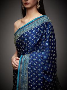 Editor's Note Embrace royal elegance with our royal/turquoise ari with tikki-h embroidered parampara ari 60 kasab sari, complete with an unstitched blouse. This ensemble is the epitome of traditional opulence, perfect for special occasions and events where you want to make a regal and sophisticated statement. The intricate embroidery and rich color combination ensure you stand out and leave a lasting impression. With the convenience of an unstitched blouse, you can customize your look to your li Luxury Royal Blue Banarasi Silk Dupatta, Festive Blue Tussar Silk Pre-draped Saree, Elegant Blue Dola Silk Pre-draped Saree, Blue Tussar Silk Pre-draped Saree With Dupatta, Blue Dola Silk Pre-draped Saree With Zari Weaving, Traditional Blue Pre-draped Saree With Resham Embroidery, Festive Blue Art Silk Pre-draped Saree, Blue Dola Silk Pre-draped Saree For Reception, Blue Silk Pre-draped Saree In Traditional Style