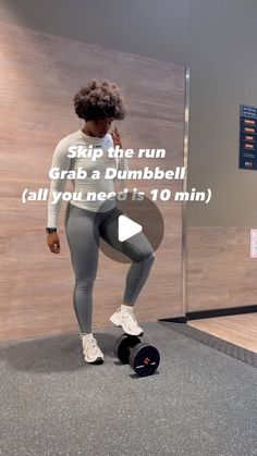 a woman in grey leggings and white top is doing exercises