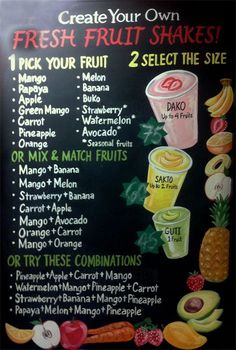 the menu for fresh fruit shakes is displayed on a blackboard with white writing and colorful graphics