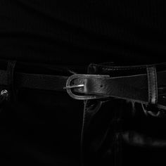 The product in question is a black leather belt with a silver buckle.The belt features a series of small crosses engraved on the surface of the buckle, which create a unique and distinctive design.The black leather is of high quality and guarantees resistance and durability over time, while the buckle is in 925% silver, robust and resistant to corrosion.The combination of these two materials creates an elegant and sophisticated contrast, which fits perfectly with formal or casual wear. This belt Black Leather Belt With Buckle Closure, Black Belt With Buckle Closure, Black Business Belts With Buckle Closure, Black Buckle Belts For Business, Black Business Belt With Buckle Closure, Black Leather Belt Buckles With Silver Buckle, Classic Black Belt Buckles With Silver Buckle, Black Belt Buckles With Silver Buckle For Business, Adjustable Black Belt With Leather Strap