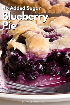 a close up of a plate of blueberry pie