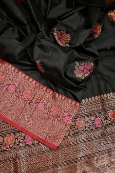 This latest collection is in a black and red color combination, a pure tussar silk banarasi saree with golden zari and meenakari work, and in an alluring meenar butta work on the body and traditional meenakari work on the pallu and the border and all over. Color: A shade of black and red color Technique: A pure and refined hand-done work of border with meenakari zari work and traditional meena butta work Fabric: Tussar Quality: IndyVogue's Assurance of Silk Mark Certification Note: Comes with contrasting color Meena brocade blouse piece. All Over Color, Red Color Combinations, How To Wash Silk, Silk Banarasi Saree, Brocade Blouse, Brocade Blouses, Color Techniques, Banarasi Saree, Zari Work