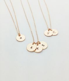 A sweet necklace for moms and grandmas! The necklace features dainty 9mm disk pendants with the initials of your choosing. Each disk comes in 14kt Gold filled, Sterling Silver, or rose gold filled (waterproof!). The disks will match the chain you choose. The circles are hand-stamped by me in my little studio, I make these with lots of love and care!  Wish there was an additional charm added? A symbol? Something else? We love to customize - just send us a message! Details *Circle: 9mm.,14kt Gold Simple Personalized Round Pendant Necklace, Dainty Hand Stamped Round Necklaces, Simple Round Pendant Charm Necklace For Anniversary, Rose Gold Round Necklace Gift For Mom, Rose Gold Necklace For Mom, Round Rose Gold Coin Necklace Gift, Rose Gold Round Necklace For Mom, Initial Round Pendant Necklace For Mother's Day Anniversary, Initial Round Pendant Necklace For Anniversary And Mother's Day