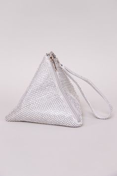 The perfect evening bag when you're feeling glamorous! The Rhinestone Triangle Bag is adorned in all-over rhinestones and features a chic ring handle bag design. Other details include a removable chain, snap button front closure, and silk interior. 8" x 6" x 6" Holds smaller items: lipstick, i.d., money, and keys. ﻿Compatible with small mobile phones. Colors may vary with different viewing devices. Silver Handheld Clutch With Rhinestones, Glamorous Bags With Silver-tone Hardware For Events, Glamorous Event Bags With Silver-tone Hardware, Silver Bling Clutch For Events, Silver Crystal Bag For Party, Chic Silver Clutch With Pearl Handle, Silver Crystal Party Bag, Silver Bling Bag For Events, Silver Rhinestone Bags For Events