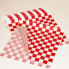 two pieces of red and white checkered paper