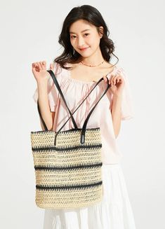 Make a statement with our Woven Striped Tote with Leather Handles, perfect for an effortlessly stylish look. 

With its durable cellulose material and trendy color-blocking design, this tote boasts a chic vertical square shape and features a practical internal phone pocket. The soft texture and striped pattern add a touch of sophistication, while the leather handles ensure comfortable carrying, making it an ideal accessory for your daily endeavors or leisure activities. 

Take this versatile tot Versatile Rectangular Straw Bag For Daily Use, Chic Large Capacity Straw Bag For Shopping, Spring Rectangular Bucket Bag For Daily Use, Trendy Rectangular Bucket Bag For Shopping, Square Bucket Bag With Braided Handles, Summer Black Bucket Bag For Shopping, Rectangular Summer Shoulder Bag For Shopping, Chic Large Capacity Rectangular Beach Bag, Summer Style Rectangular Shopping Shoulder Bag