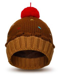 a brown knitted hat with a red pom - pom on the top