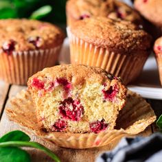 muffins with cranberry filling on a wooden table