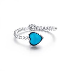 * INTRODUCTION----- This ring is made with high-quality genuine Persian blue turquoise. Inspired by the gorgeous sky blue color that's like a bright sky. The design symbolizes how love is infectious and wraps around your heart. The intense blue color looks clean and bright with little to none matrix. The design is a classic bypass style. Featuring a bezel set CZ. A great casual gift for your love or just for yourself. Baikalla gemstones are genuine stones that are highly valued for their beauty,