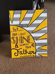 a yellow and gray canvas with the words let your light shine and glorfy your father on it