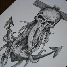 an octopus with a cross on it's head is depicted in this tattoo design