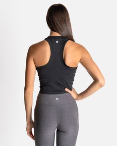 If you love our Bella Ribbed Tank, then say hello to the CROPPED Bella Ribbed Tank. Just a little extra crop for those who like a shorter length in their tank. This fabric has lots of stretch, so it will never chafe and will always keep you feeling cool, confident, and comfortable. With a racerback cut, no cups or removable shelf bra—so you can wear this tank over any workout bra you choose—it’s also incredibly versatile in a variety of activities. Fitted Racerback Crop Top With Built-in Bra, Stretch Racerback Crop Top For Yoga, High Stretch Black Bra-friendly Tops, Black Stretch Crop Top Sports Bra, High Stretch Black Bra Friendly Tops, Black High Stretch Bra-friendly Tops, Black High Stretch Bra Friendly Tops, Functional Cropped Top With Built-in Bra, Fitted Racerback Crop Top For Yoga