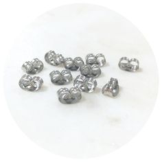 small silver metal beads on a white background