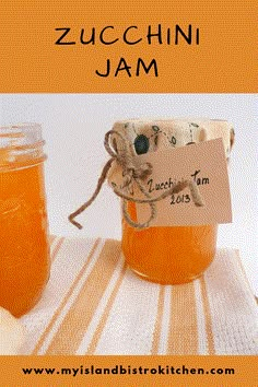 a jar filled with orange liquid sitting on top of a table