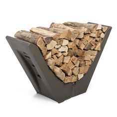 a stack of firewood sitting on top of a metal stand next to a pile of logs