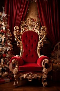 a red chair sitting in front of a christmas tree