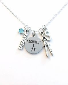 Gift for Architect Necklace, Architecture Jewelry, Compass and ruler charm, Retirement or Graduation Present  This necklace purchase includes: - a stainless steel laser engraved Architect charm: 3/4" x 7/8" approx - an antique silver compass and ruler charm - Swarovski crystal of your choice (see picture)  - initial charm of your choice - a 18" sterling silver plated link chain** (or you can choose length) - in an organza gift bag, ready to give as a gift ** PLEASE LEAVE ME A NOTE UPON PAYMENT I Adjustable Stainless Steel Charm Necklaces, Hobby Lobby Gift Card, Architecture Jewelry, Compass Jewelry, Cheap Hobbies, Gift For Architect, Souvenir Jewelry, Finding A Hobby, Graduation Present