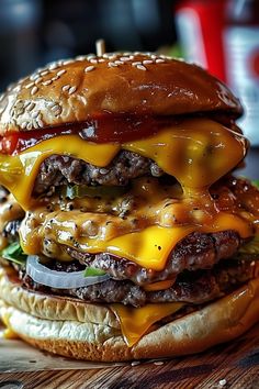 a cheeseburger is stacked on top of each other and ready to be eaten