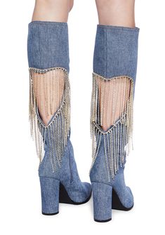 cuz let's party. These boots have a denim construction, a cut out heart design with rhinestone fringe on the back, a pointed toe design, block heels, and side zipper closures. Spring Boots With Rhinestone Fringe, Trendy Fringe Boots For Party, Trendy Party Boots With Fringe, Fall Party Denim Blue Jeans, Chic Denim Blue Jeans For Party, Denim Pointed Toe Boots For Party, Denim Blue Pointed Toe Party Boots, Party Denim Blue Pointed Toe Boots, Party Jeans With Rhinestone Fringe