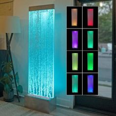 an illuminated water feature in the corner of a room