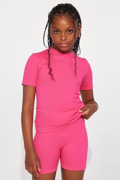 Available In Fuchsia, Black, And White. Seamless Short Sleeve Crew Neck Cropped Model Wears Size 10/12 93% Polyamide 7% Spandex Imported | Mini Catching A Sweat Seamless Tee Shirt in Fuchsia size 14/16 by Fashion Nova Pink Ribbed Stretch T-shirt, High Stretch Ribbed Pink Top, Pink High Stretch Seamless Top, High Stretch Pink Top With Short Sleeves, Pink Ribbed Crew Neck T-shirt, Pink Ribbed Fitted T-shirt, Fitted Ribbed Pink T-shirt, Fitted Pink Ribbed T-shirt, Pink Fitted Ribbed T-shirt