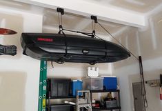 a garage with tools hanging from the ceiling