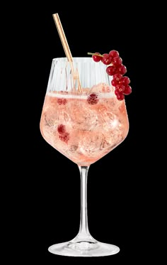 a wine glass filled with ice and garnish