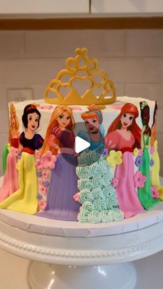 there is a cake with princesses on it