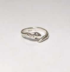 "Handmade solid sterling silver ring, an artisan jewel with organic shapes with a unique texture, made to measure with a unisex design.  This model is adjustable, so no problem with the size! (But if you know it, write it on the notes so I can be more accurate Each ring is handmade and therefore will always be a unique piece.  You can choose the wide band (\"fascia larga\", height 6-7 mm/ 0.23 Inches) or tight band (\"fedina\", height 3-4 mm/0.11 Inches) version, and also the size. If you don't know your size or you prefer a more versatile ring I suggest to choose the \"adjustable\" option :-) Made in Italy, with gift box included  Lost wax technique originally introduced in the Bronze Age and which over the centuries has experienced a notable flowering, especially in Greek and Roman art a Symbolic Adjustable Ring With Unique Design, Adjustable Sterling Silver Ring With Unique Design, Hand Forged Silver Toe Ring, Sterling Silver Engraved Open Ring, Unique Hand Forged Open Engraved Ring, Unique Hand Forged Engraved Open Ring, Unique Sterling Silver Midi Rings For Anniversary, Sterling Silver Toe Rings Stamped 925, Unique Hand Forged Toe Ring